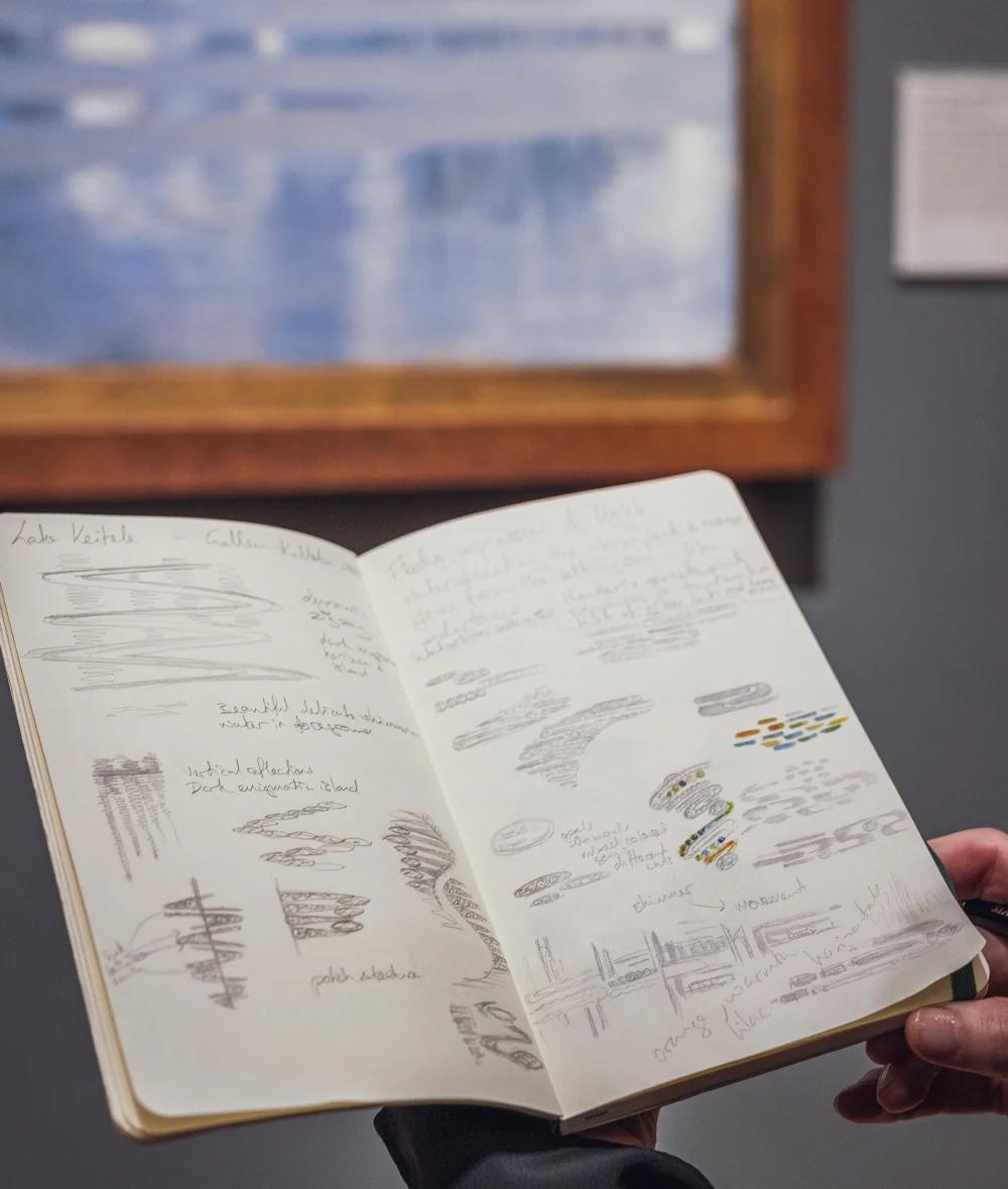 Open Boodles design sketchbook showing hand drawn jewellery concepts and gemstone colour studies inspired by paintings at the National Gallery.