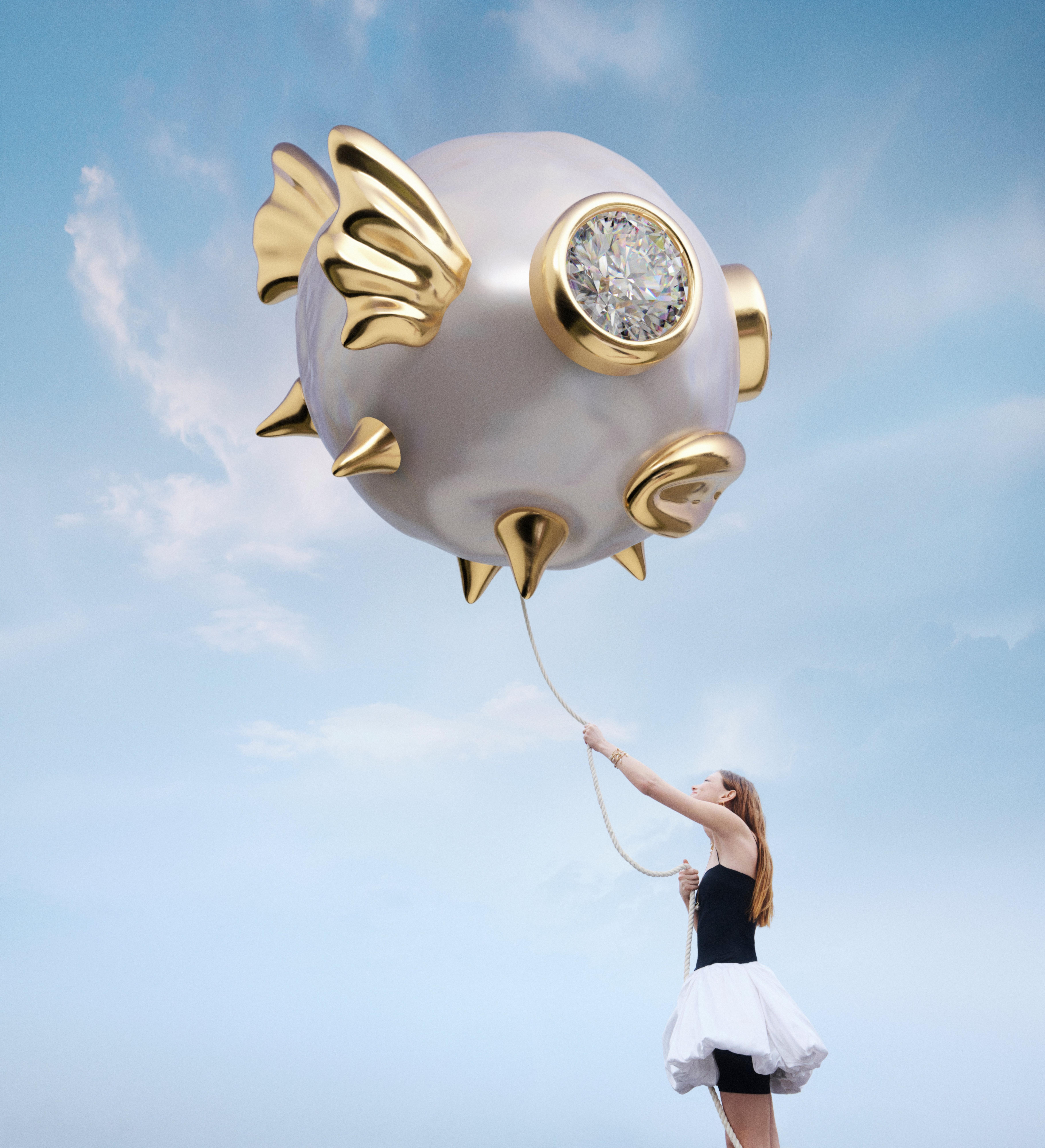Model holding a giant pearl-inspired fish installation created for the launch of Pandora Wonders and its freshwater pearl collection.