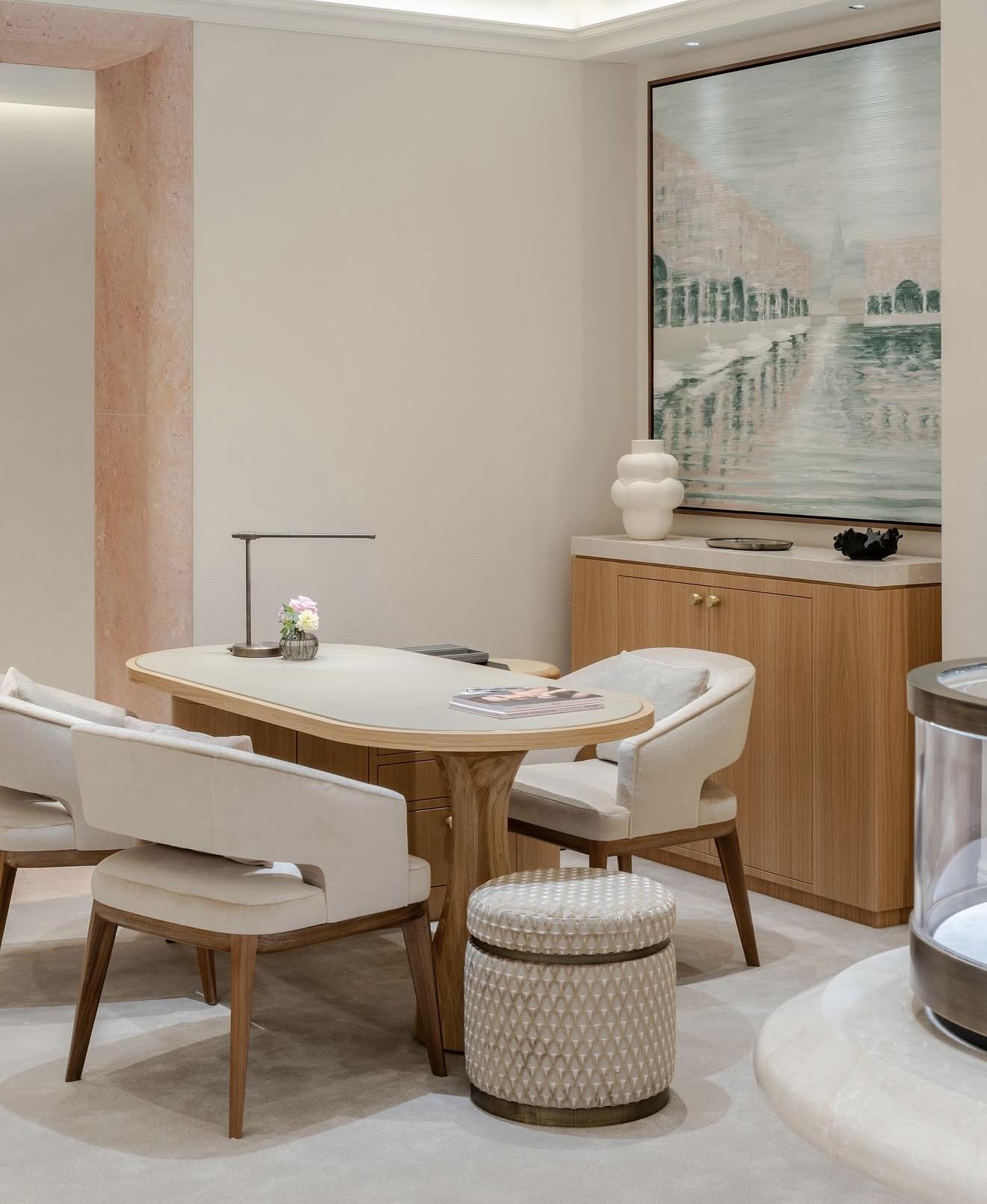 Private consultation room inside The Boodles Townhouse with a pale wooden table, upholstered chairs, soft neutral furnishings and a large framed artwork