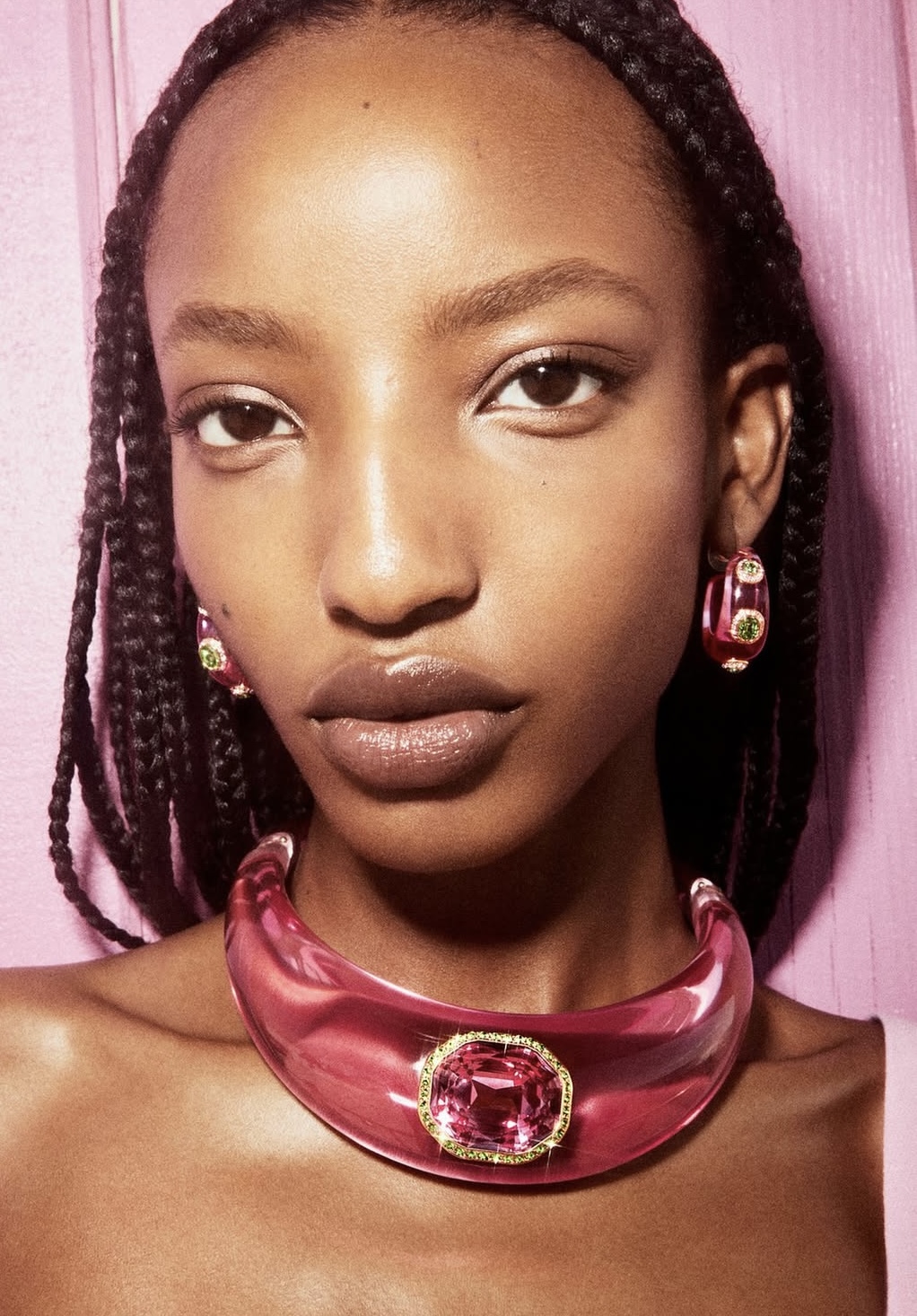 Image courtesy of Swarovski A statement crystal choker and matching earrings from the Dulcis collection take centre stage — glossy, sculptural and lit in full pop pink