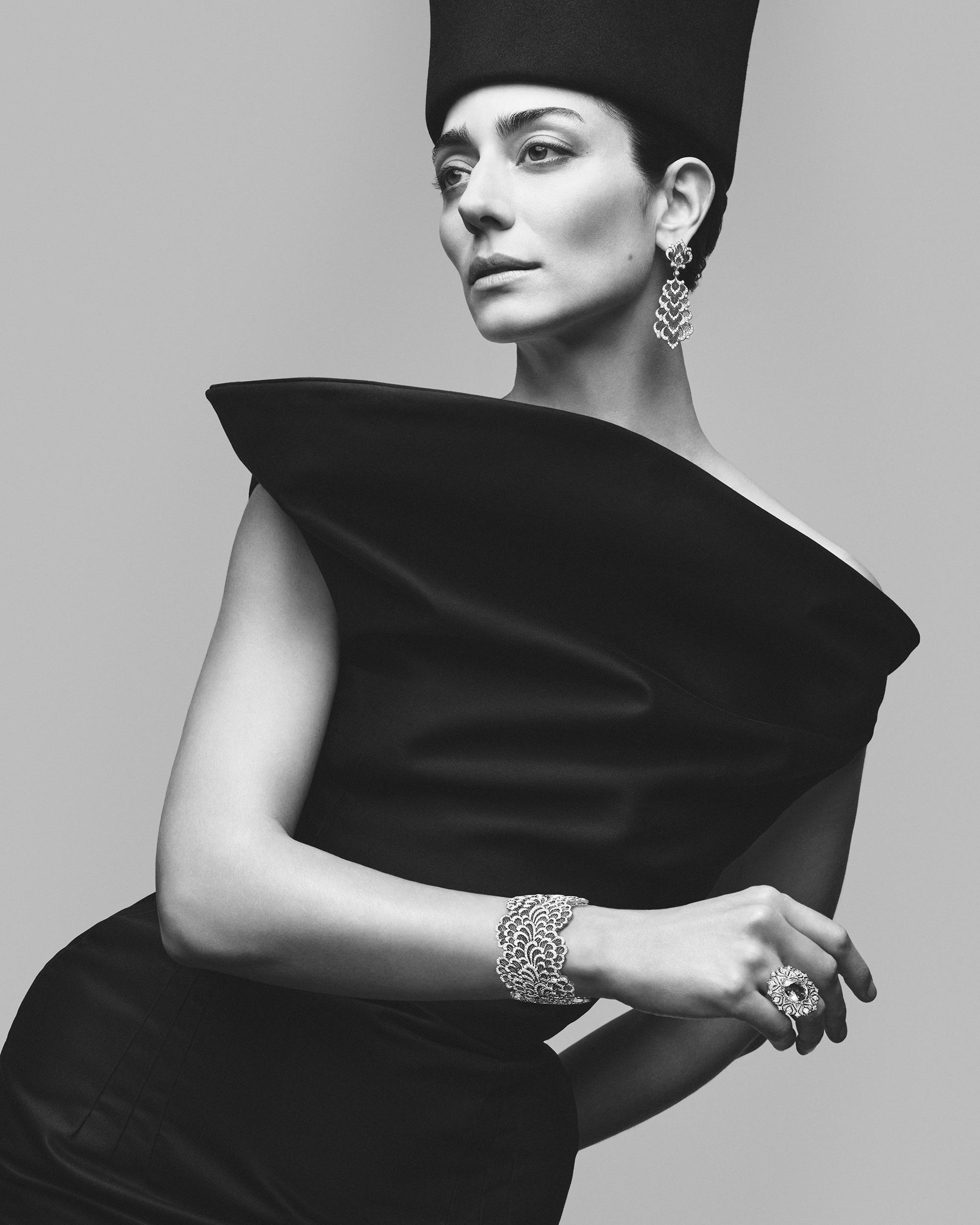 Model wearing Buccellati&rsquo;s Serenissima high jewellery collection, featuring diamond earrings, bracelet and ring inspired by Venetian lace craftsmanship.
