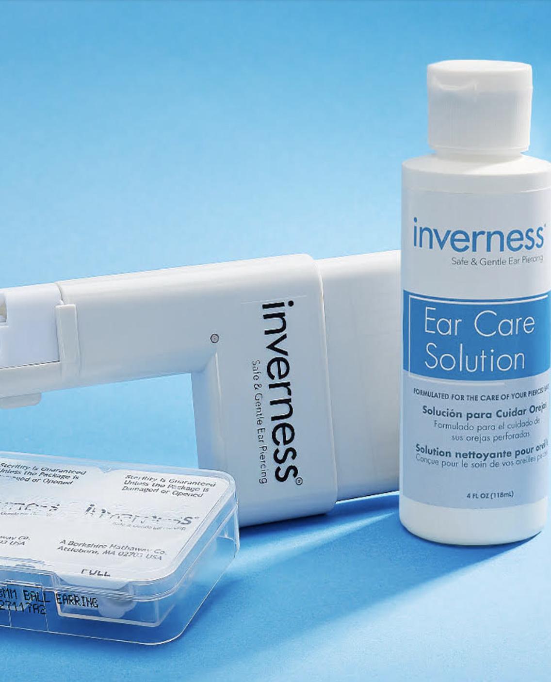 The Inverness Professional Ear Piercing System, featuring the hand-pressured instrument, sterile earring cartridge and Ear Care Solution.
