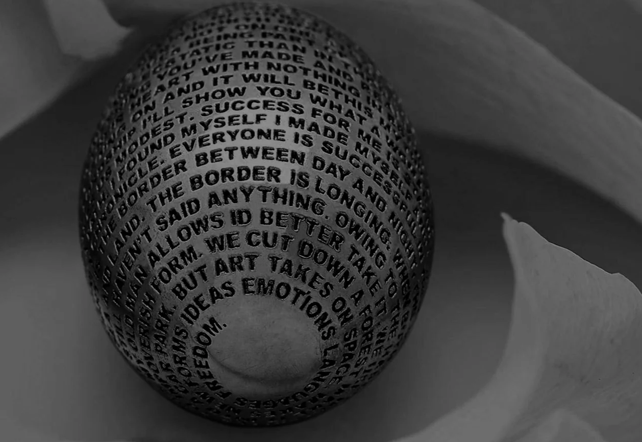 Jet McQuiston transforms miniature forms into powerful vessels of meaning, using intricate hand engraving to layer text, memory and material into wearable relics. Imagery: Courtesy of Dover Street Market