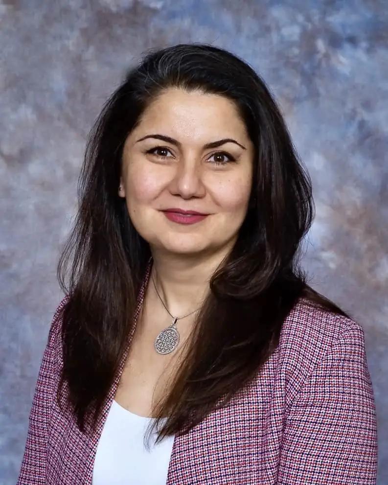 Portrait of Çiğdem Lüle, President of the Accredited Gemologists Association (AGA), recognising Kerry Gregory as the first recipient of the Alan Hodgkinson Medal for her contribution to gemological education and mentorship.