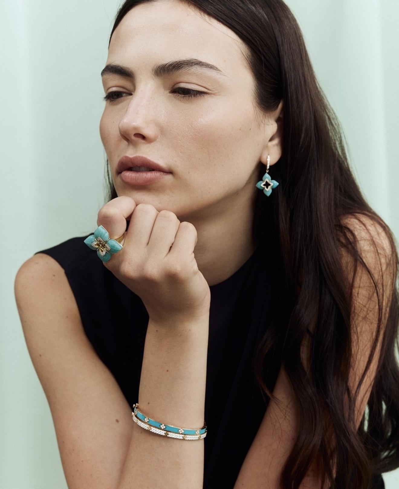 Model wearing turquoise-coloured Venetian Princess earrings, ring and bracelet by Roberto Coin.