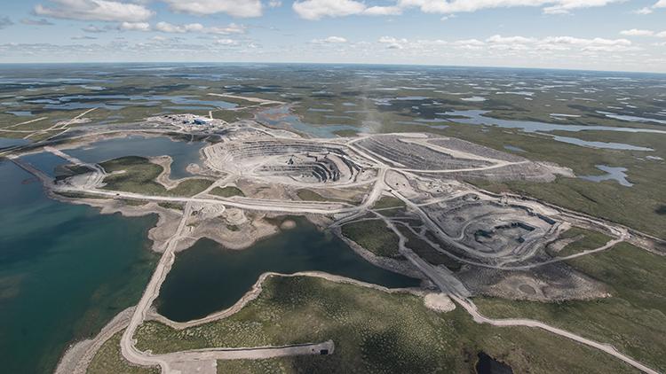 Aerial view of the open-pit Gahcho Kué diamond mine surrounded by lakes and tundra in Canada’s Northwest Territories.