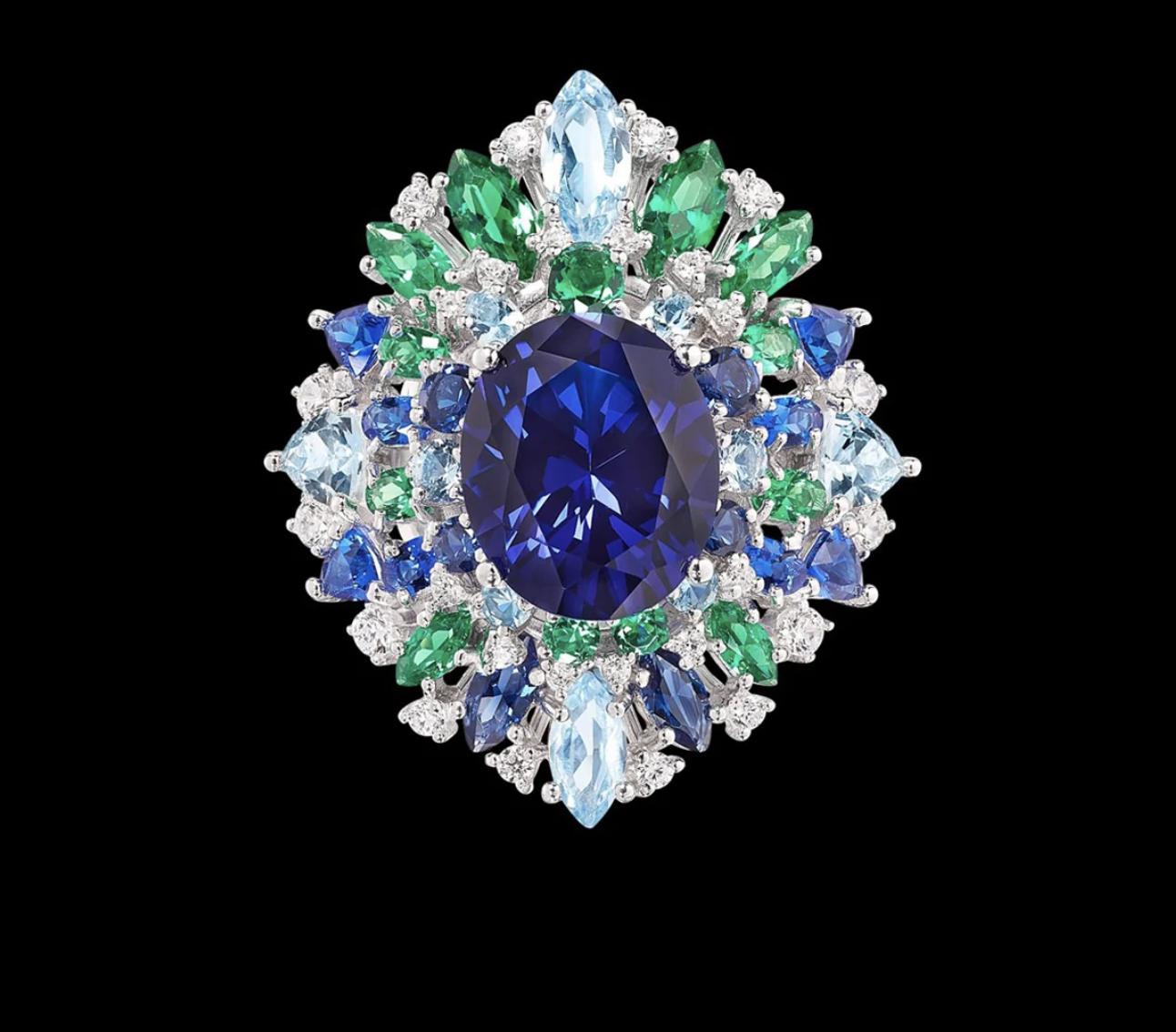 Anabela Chan statement ring with a large deep-blue centre stone surrounded by green, pale-blue, royal-blue and white stones