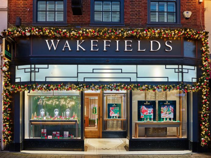 Exterior of Wakefields Jewellers boutique on West Street in Horsham decorated with festive lights and window displays.