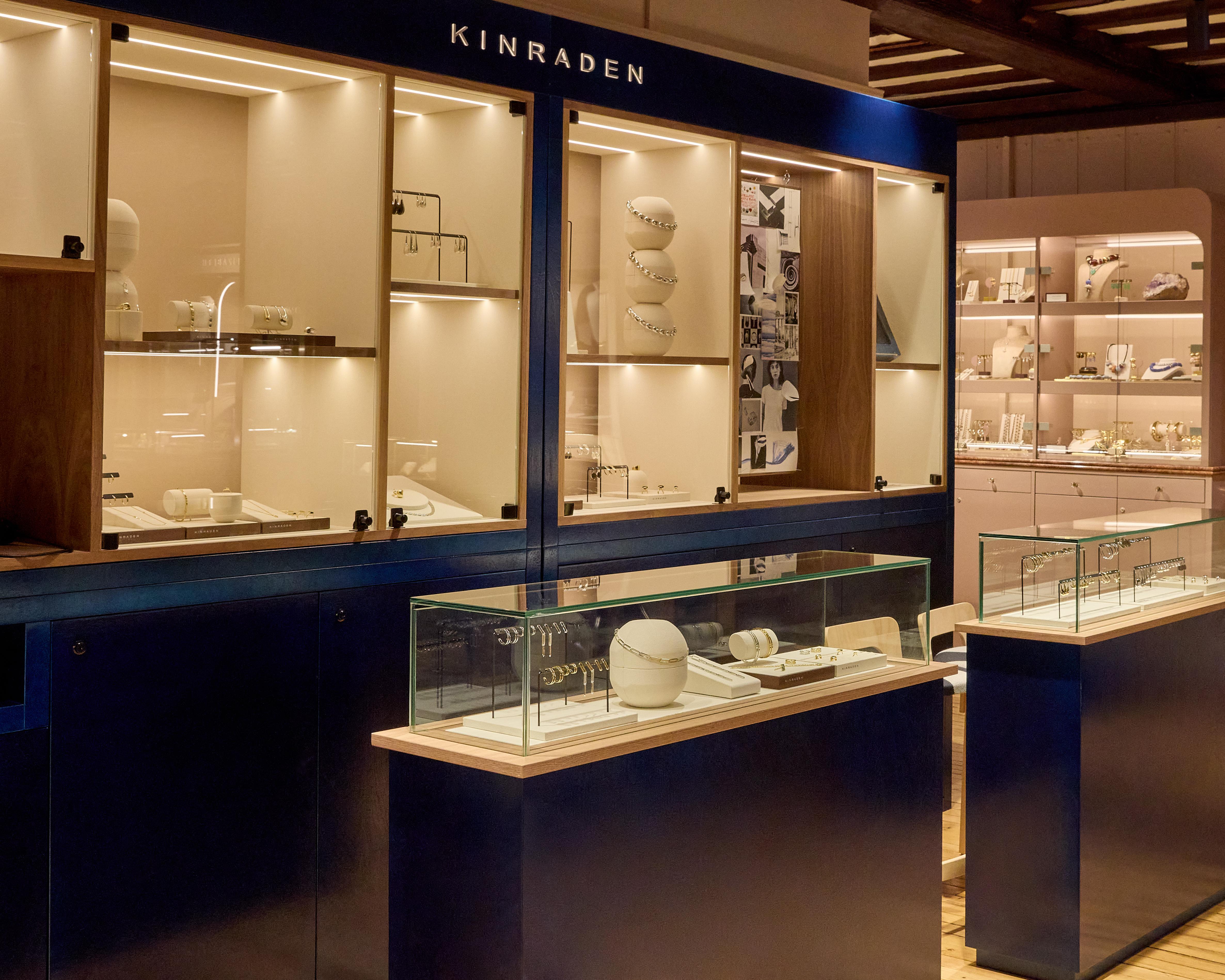 Kinraden jewellery displayed in illuminated glass cabinets and navy counters inside Liberty&rsquo;s Fashion Jewellery Gallery.