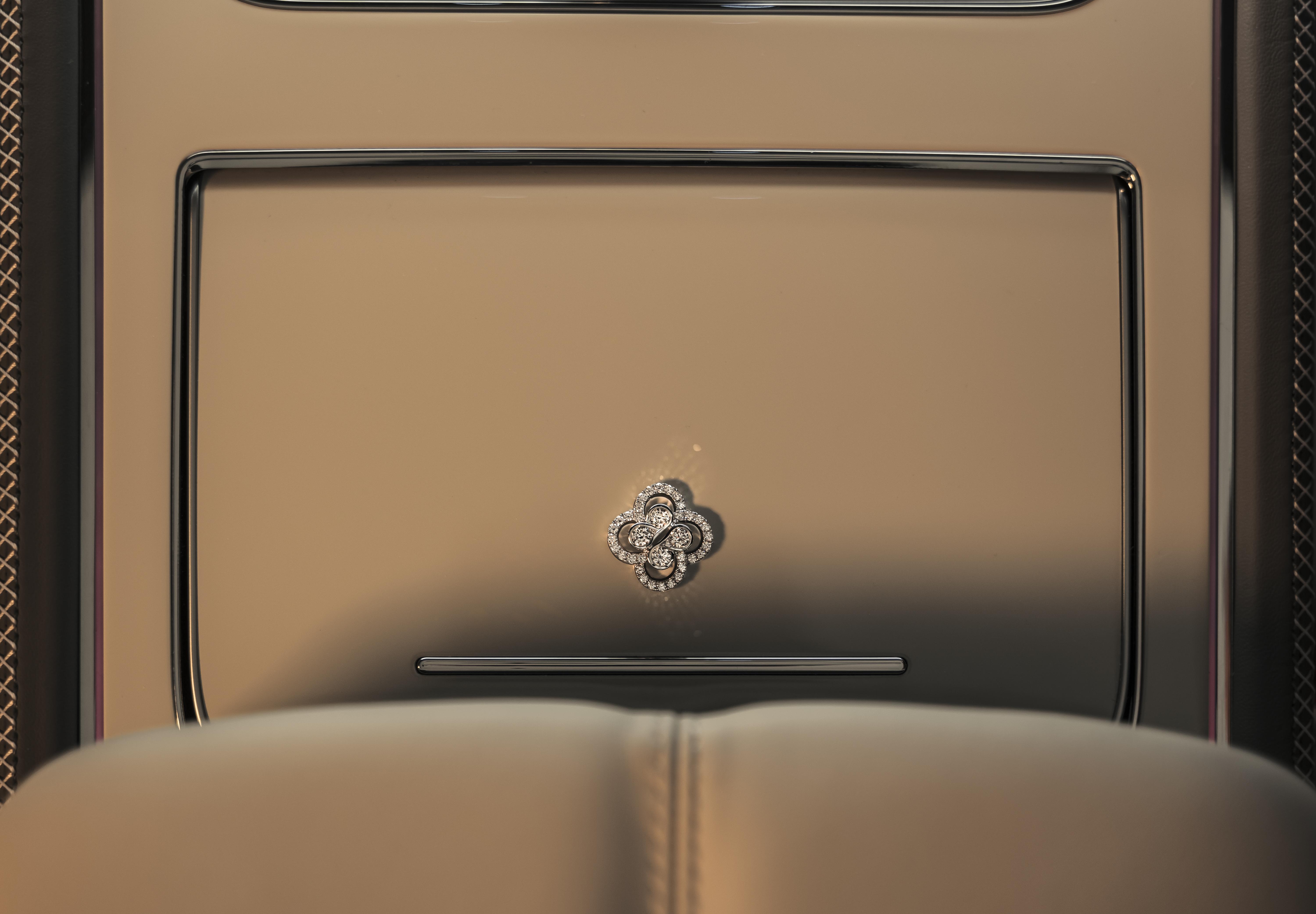 Close-up of Bentley interior featuring a diamond-set Boodles &lsquo;Be Boodles&rsquo; motif embedded in a leather panel.