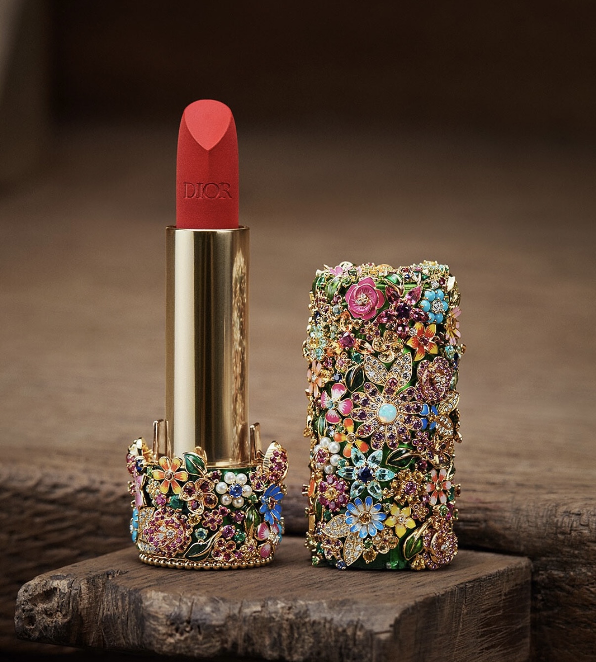Rouge Premier by Dior: A refillable lipstick encased in a gemstone-studded pendant, featuring opals, turquoise, sapphires and enamel floral motifs. Imagery: Courtesy of Dior