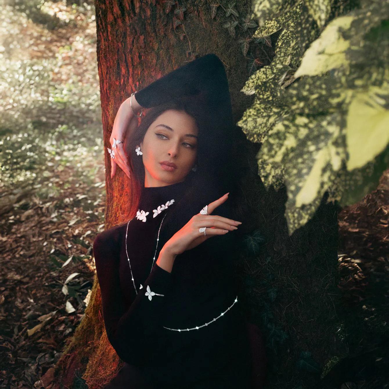 Model wearing Pasquale Bruni Giardini Segreti jewellery with floral diamond pieces in forest setting