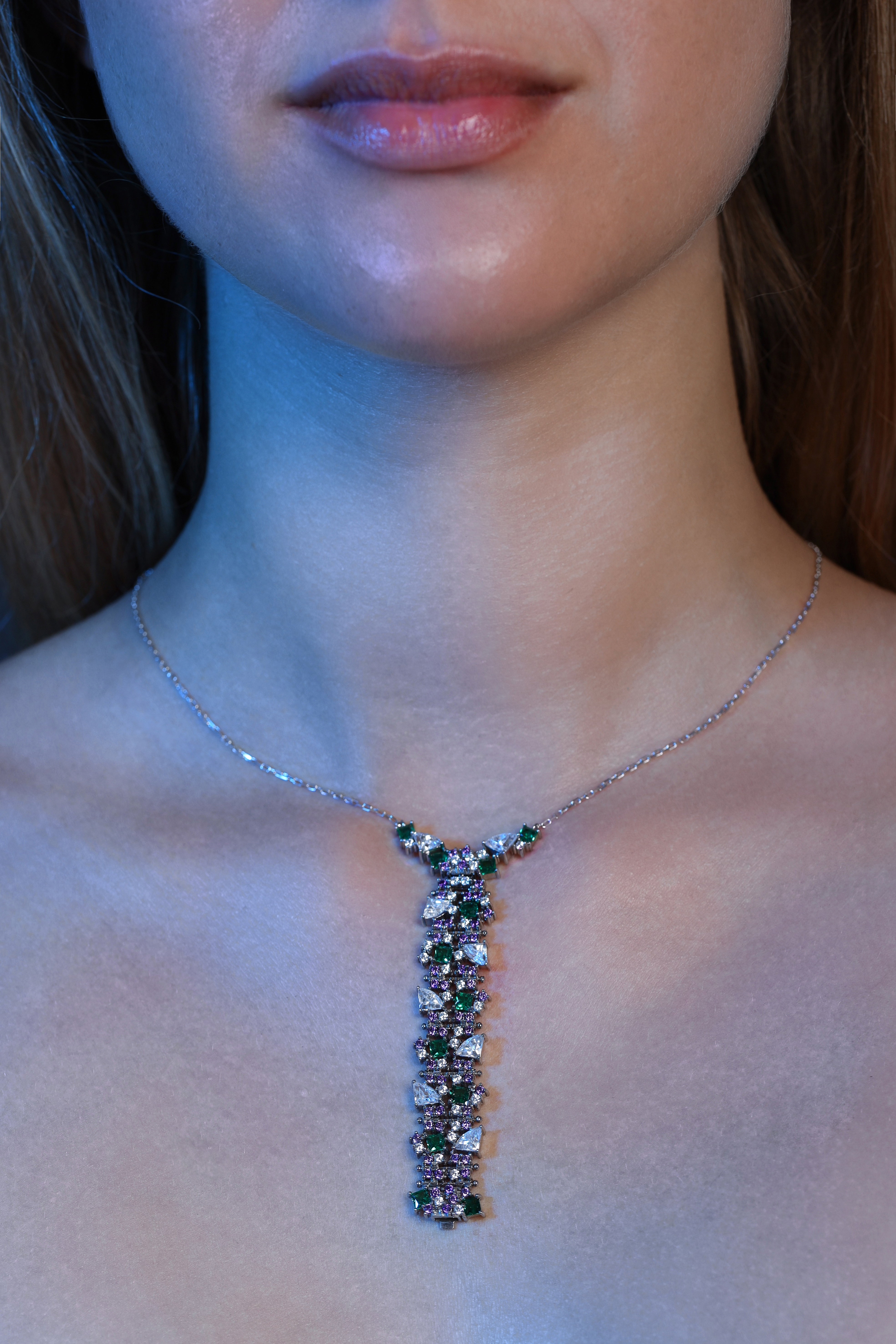 The Tsuzuri pendant in its boldest formation — a vertical composition of interlocked links set with mixed gemstones.