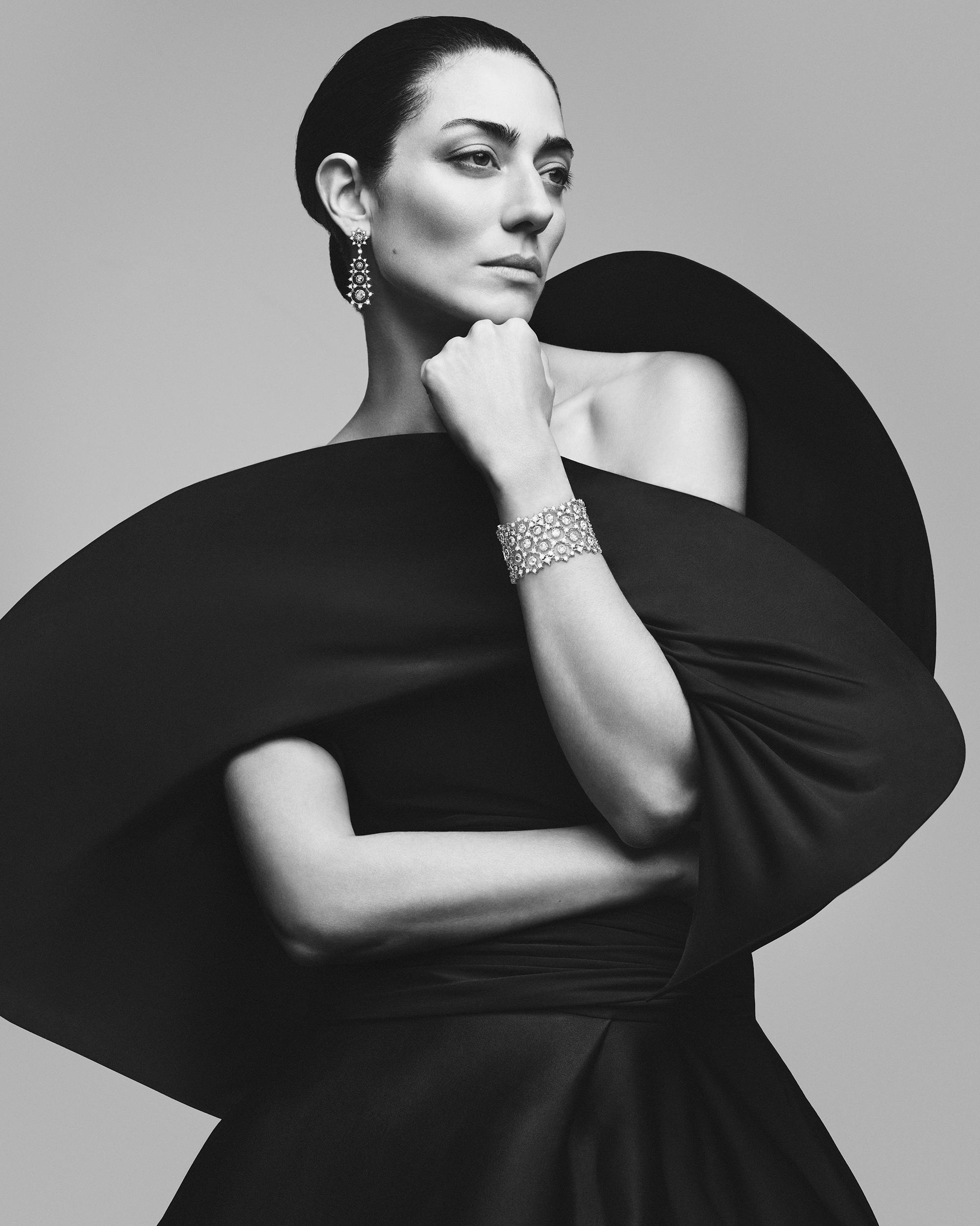 Model wearing Buccellati&rsquo;s Serenissima high jewellery collection, featuring a diamond bracelet and drop earrings inspired by Venetian lace craftsmanship.
