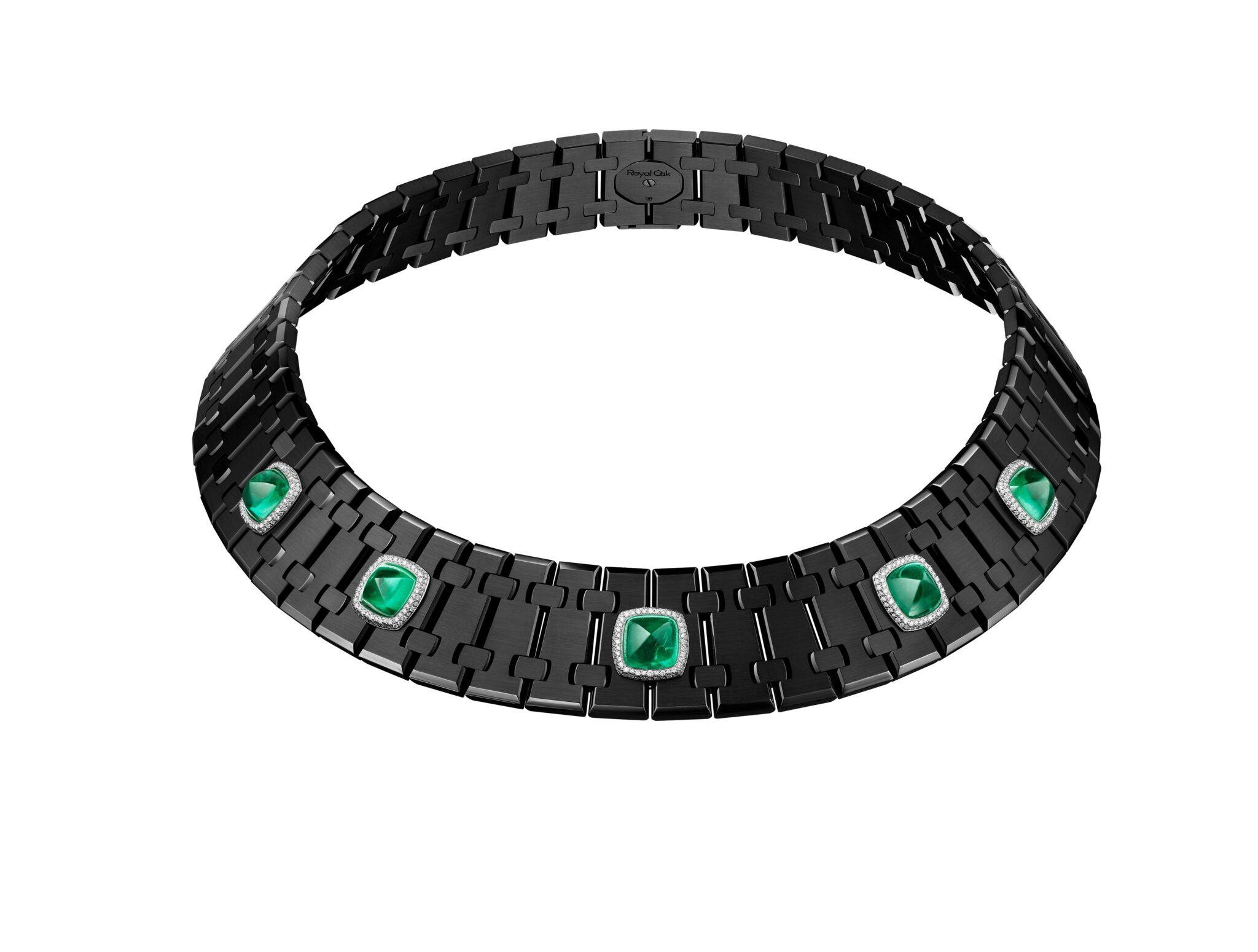 Black articulated Audemars Piguet collar necklace featuring five cushion-shaped green sugarloaf emeralds, each surrounded by a halo of white diamonds