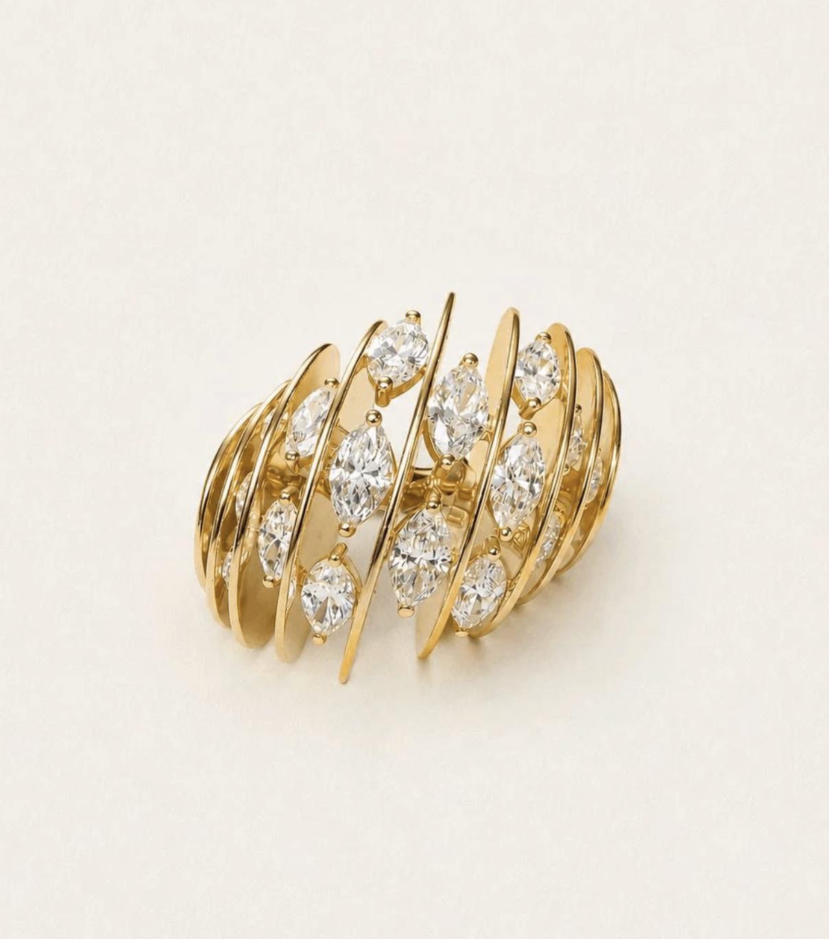 NOMIS J. Soto ring in yellow gold with marquise-cut lab-grown diamonds arranged between curved, open gold line