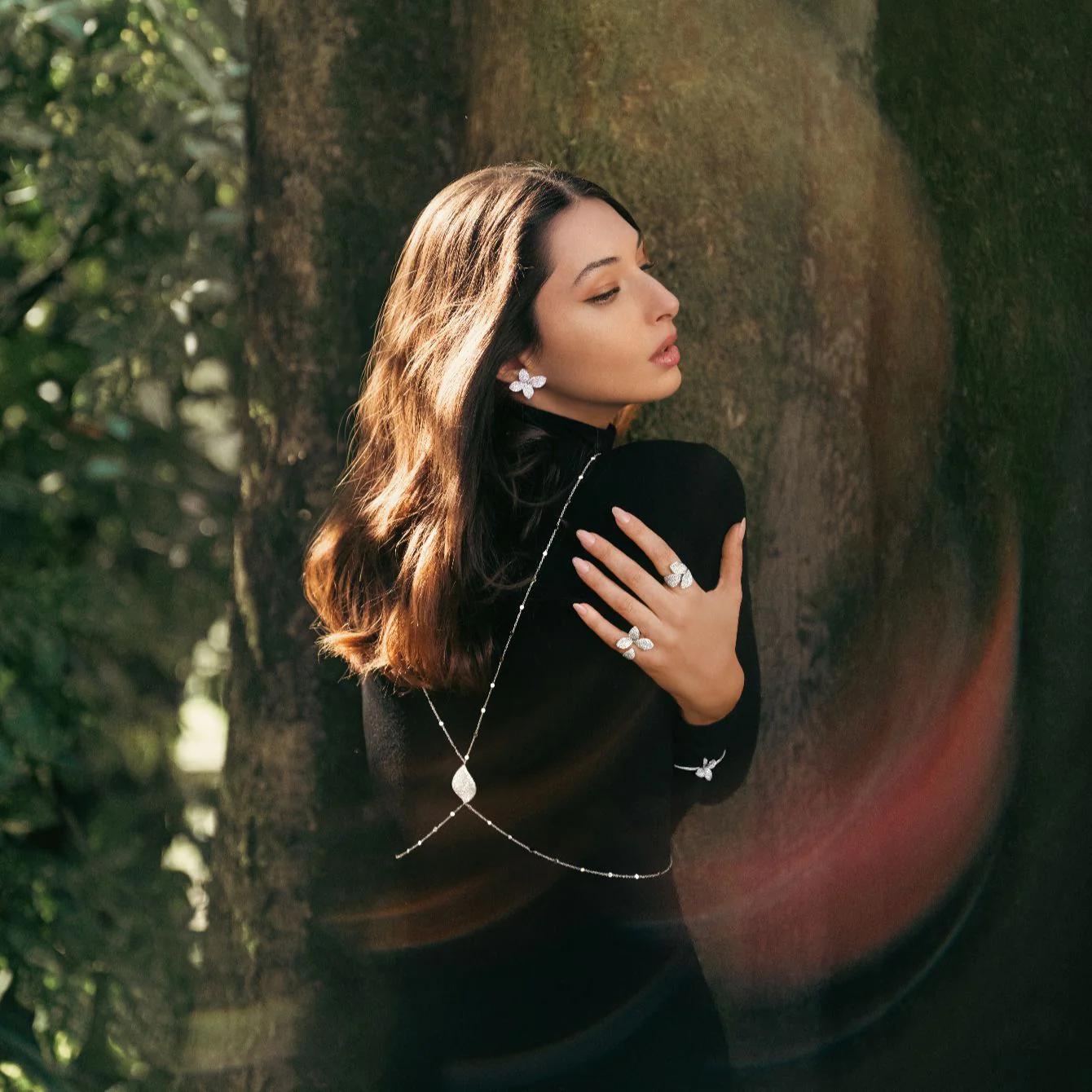 Model wearing Pasquale Bruni Giardini Segreti diamond jewellery against tree in natural setting