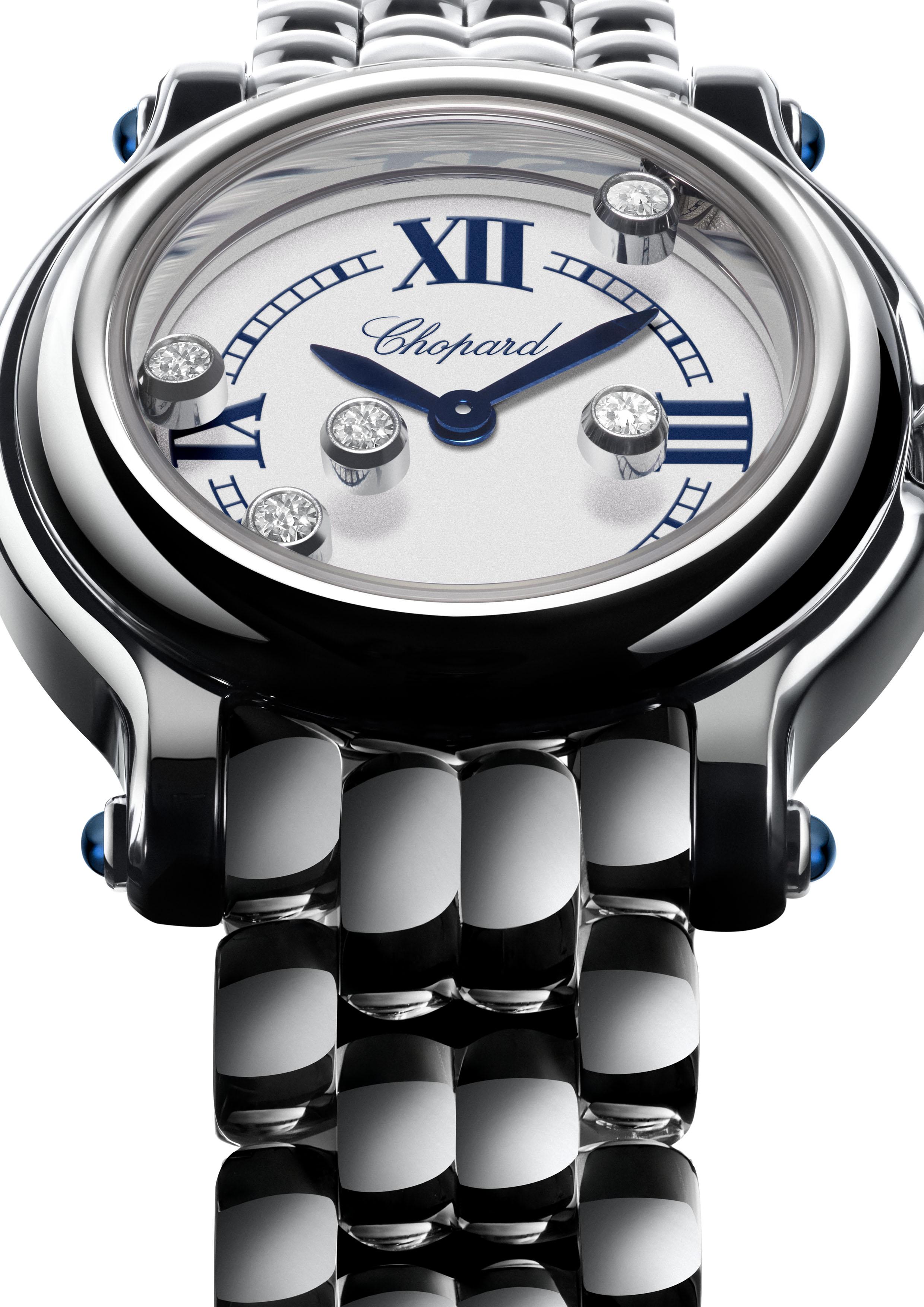 Close-up of the Chopard Happy Sport The First watch with a silver dial, blue Roman numerals, blue hands and moving diamonds beneath sapphire crystal