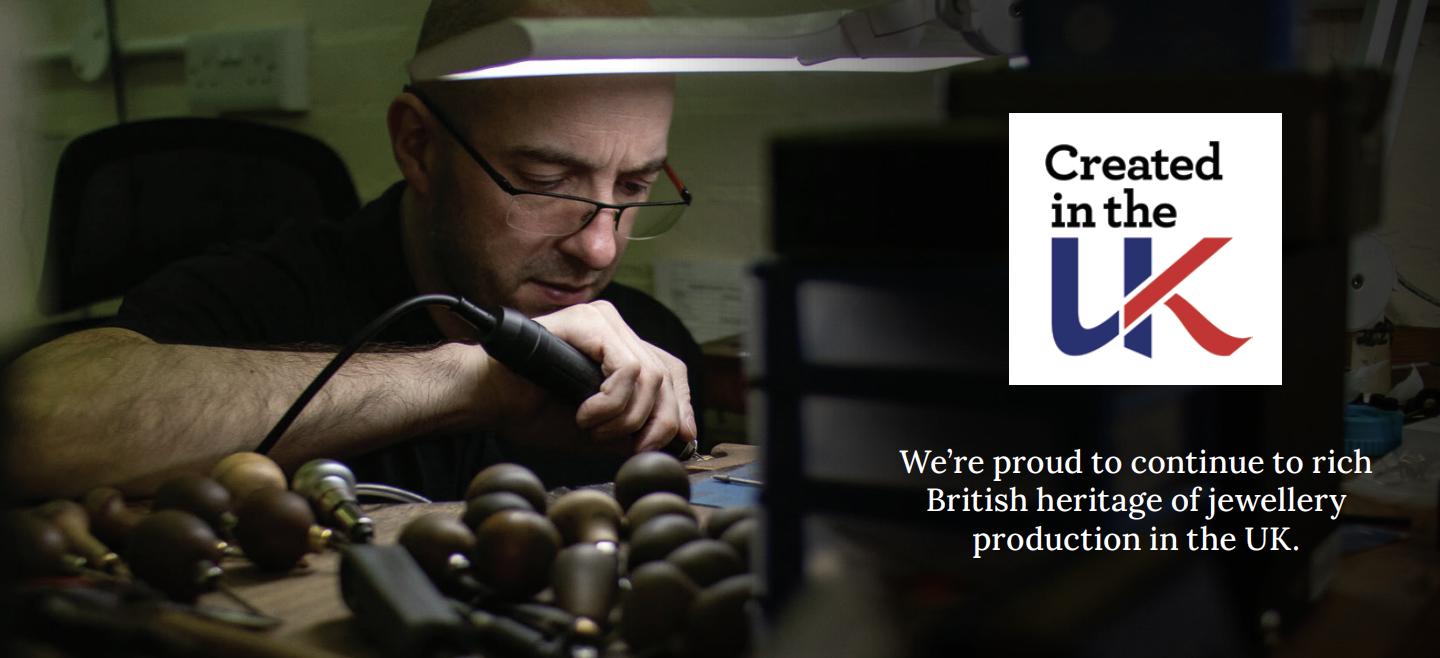 Jewellery craftsperson working by hand at a bench beside the Created in the UK logo and a message celebrating British jewellery production