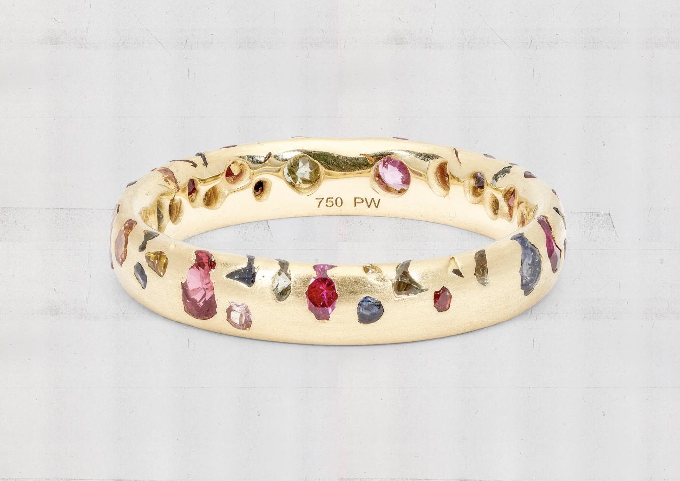 Polly Wales gold ring set with scattered pink, blue, yellow, green and purple sapphires