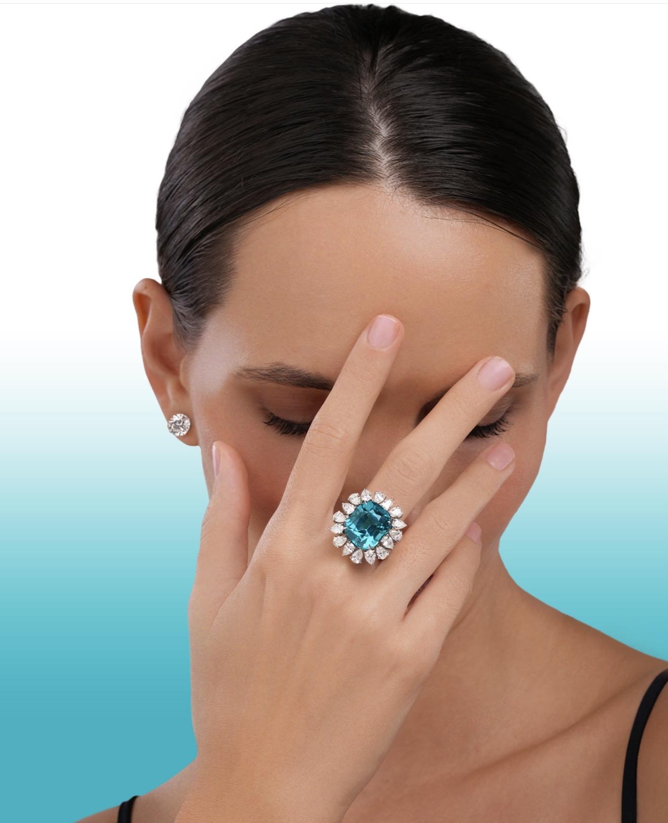 Model wearing a Spitaleri Jewellers ring featuring a large blue indicolite tourmaline surrounded by pear-shaped diamonds.