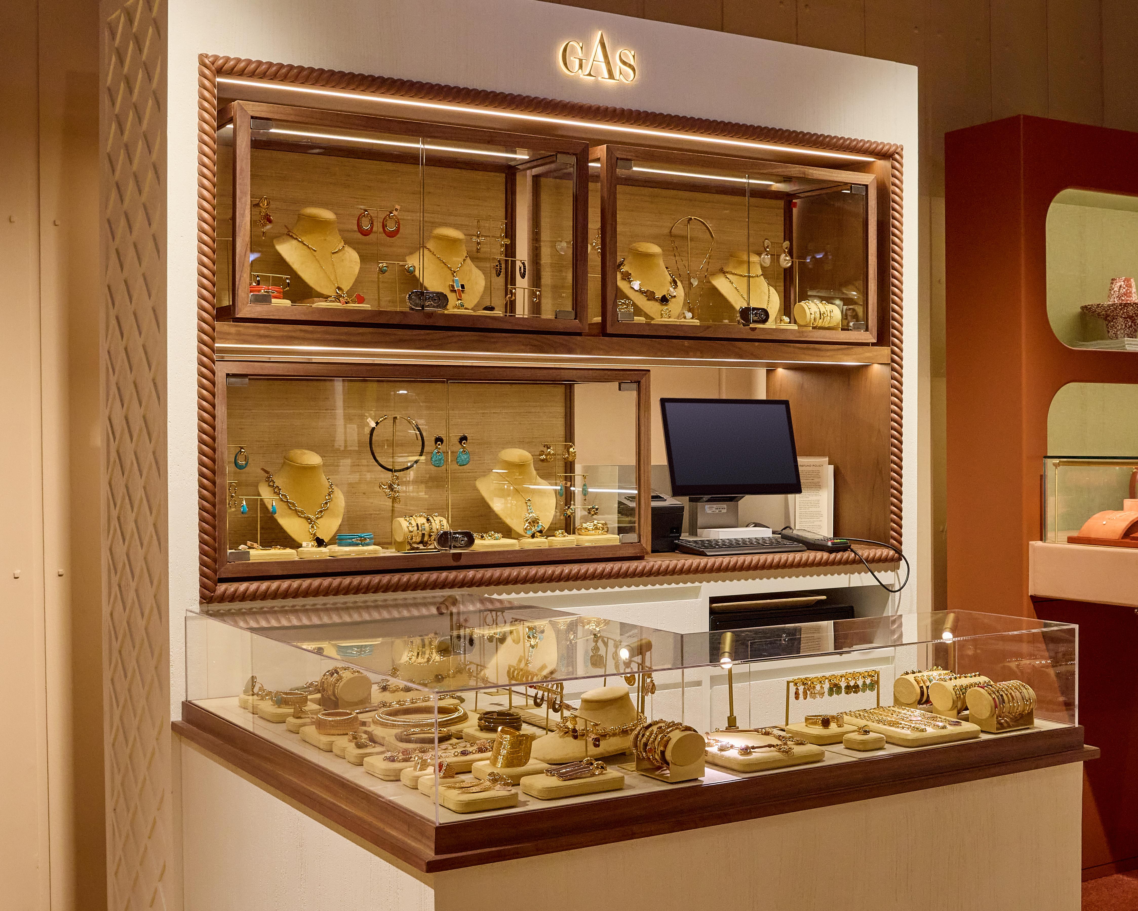 Gas Bijoux necklaces, earrings and bracelets displayed in illuminated wooden cabinets at Liberty&rsquo;s Fashion Jewellery Gallery.