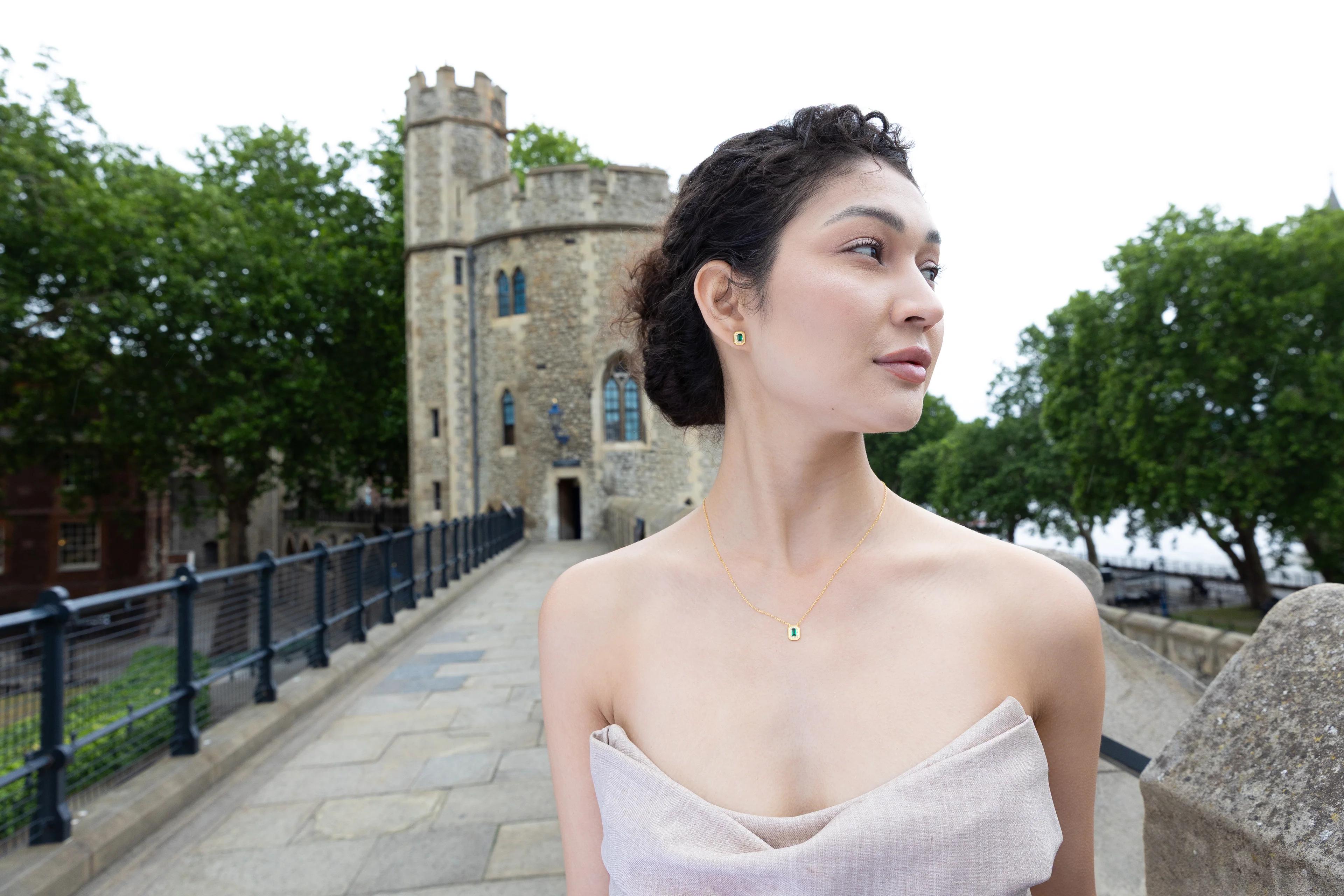 Model wearing H.AZEEM London necklace and earrings from the Historic Royal Palaces collection at the Tower of London.