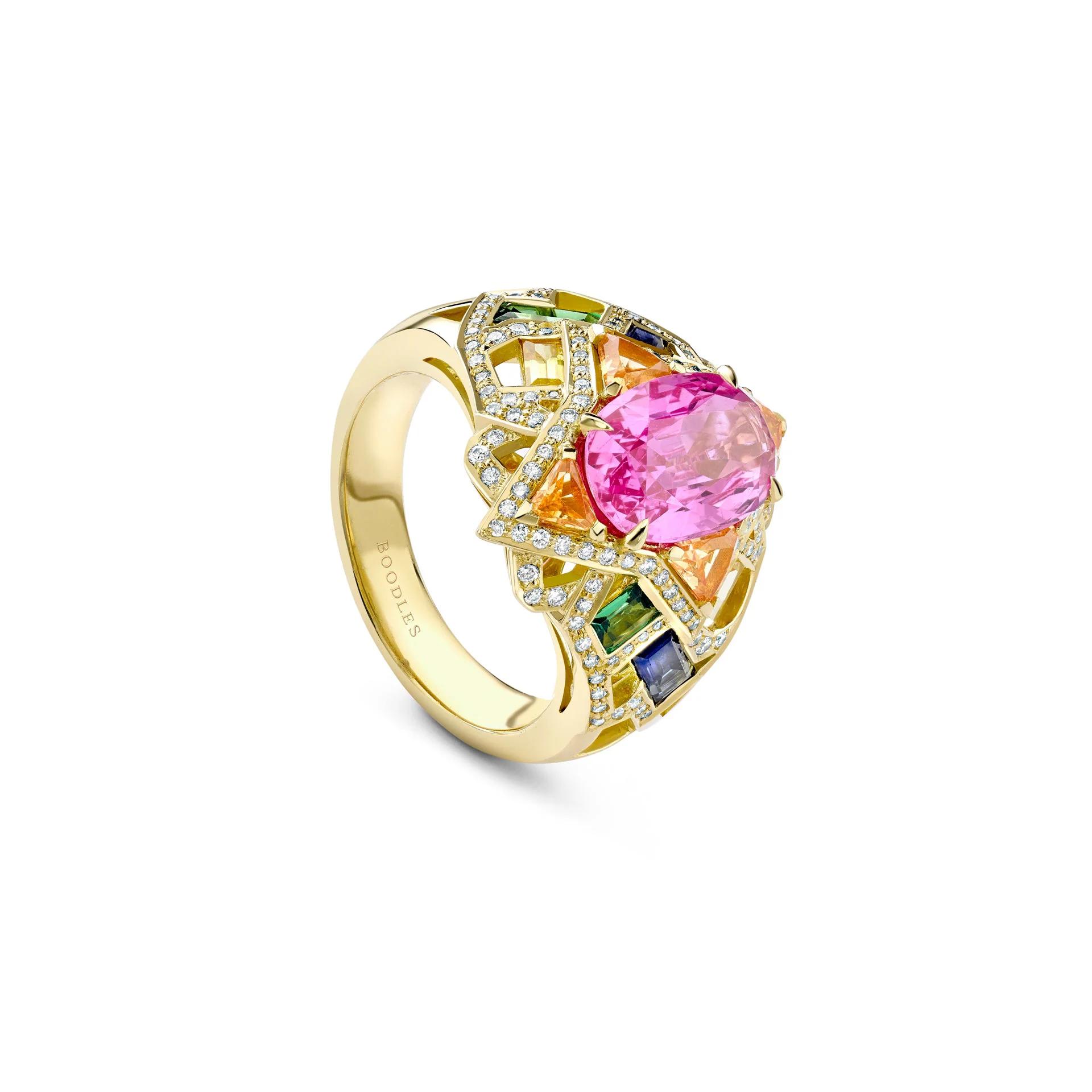 Boodles Barcelona yellow-gold ring with a large oval pink sapphire surrounded by multicoloured gemstones and diamonds