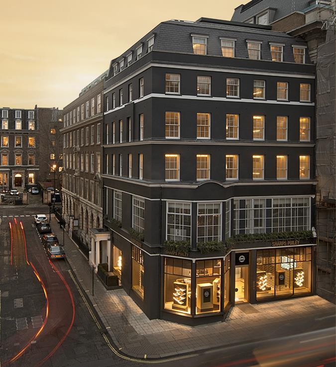 Exterior of the Sharps Pixley precious metals store on St James’s Street, London, illuminated at dusk